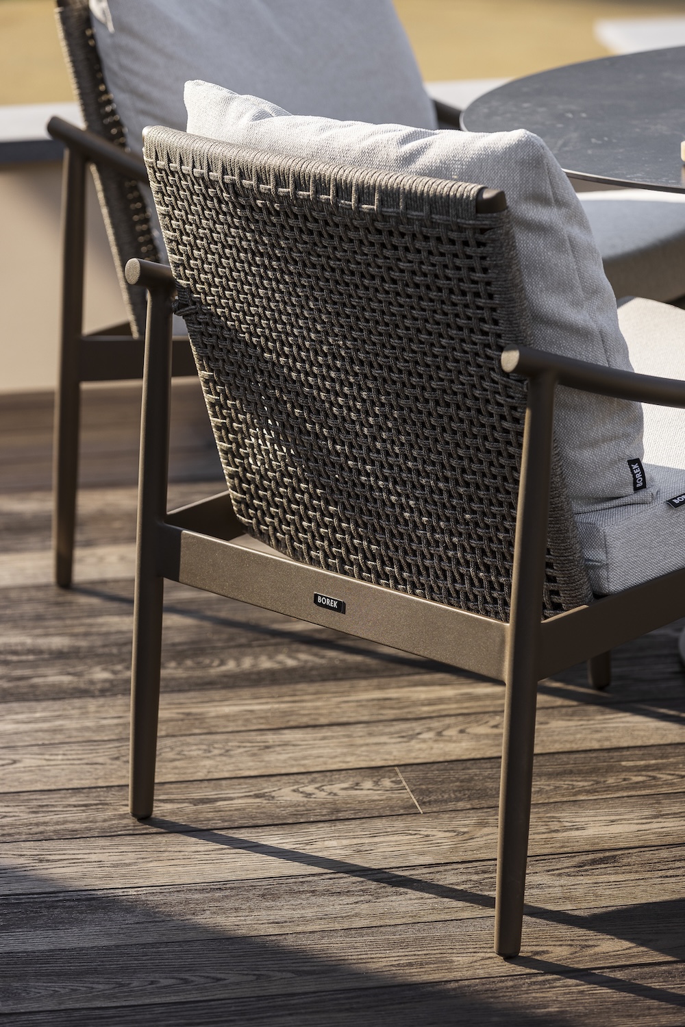 2026 BOREK - frame bronze belt wengé Low dining chair Navarra detail (1).jpg
